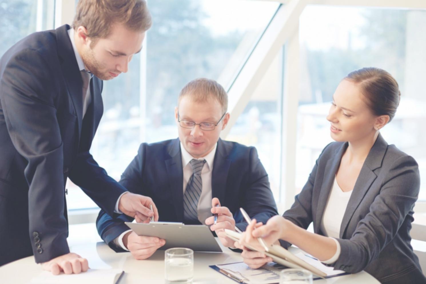 Full-stack development workspace with multiple monitors showing code and web applications